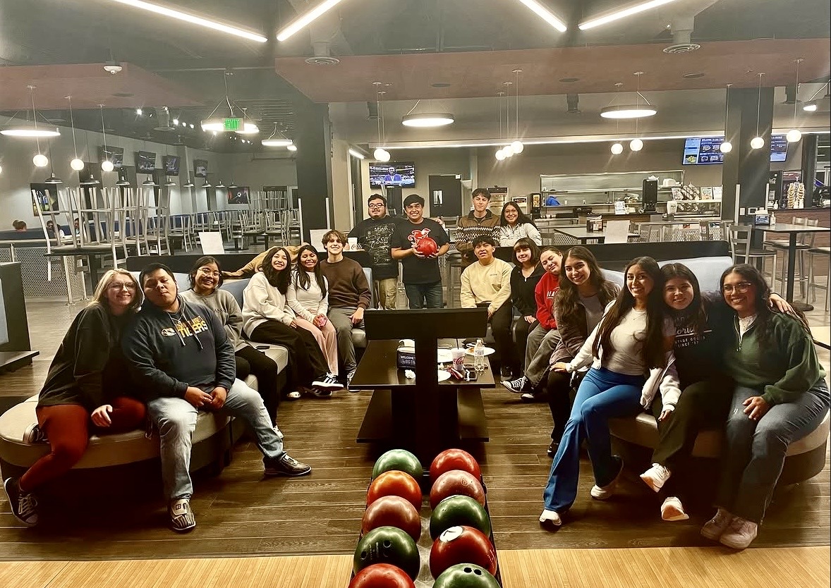El Latido members gathered together during a bowling social